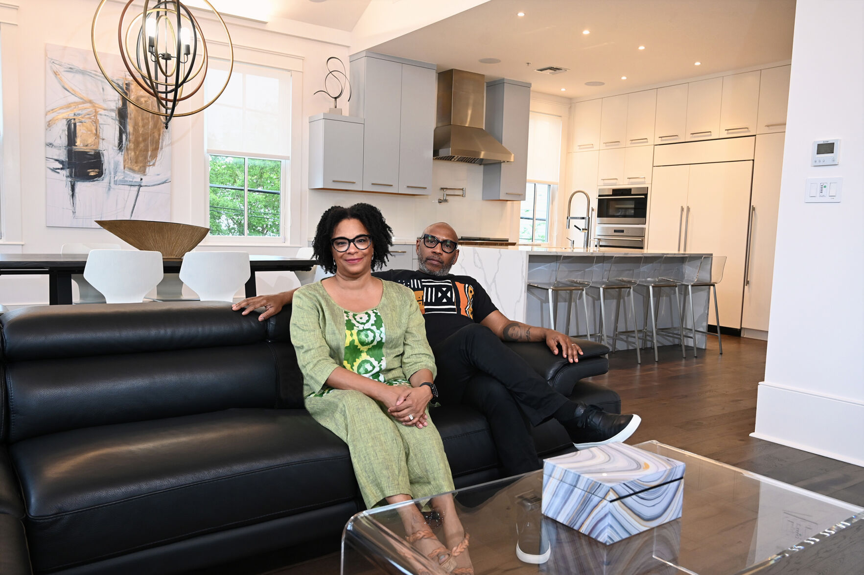 From a hanging fireplace to a caged elevator, this sleek Magazine Street home is a standout